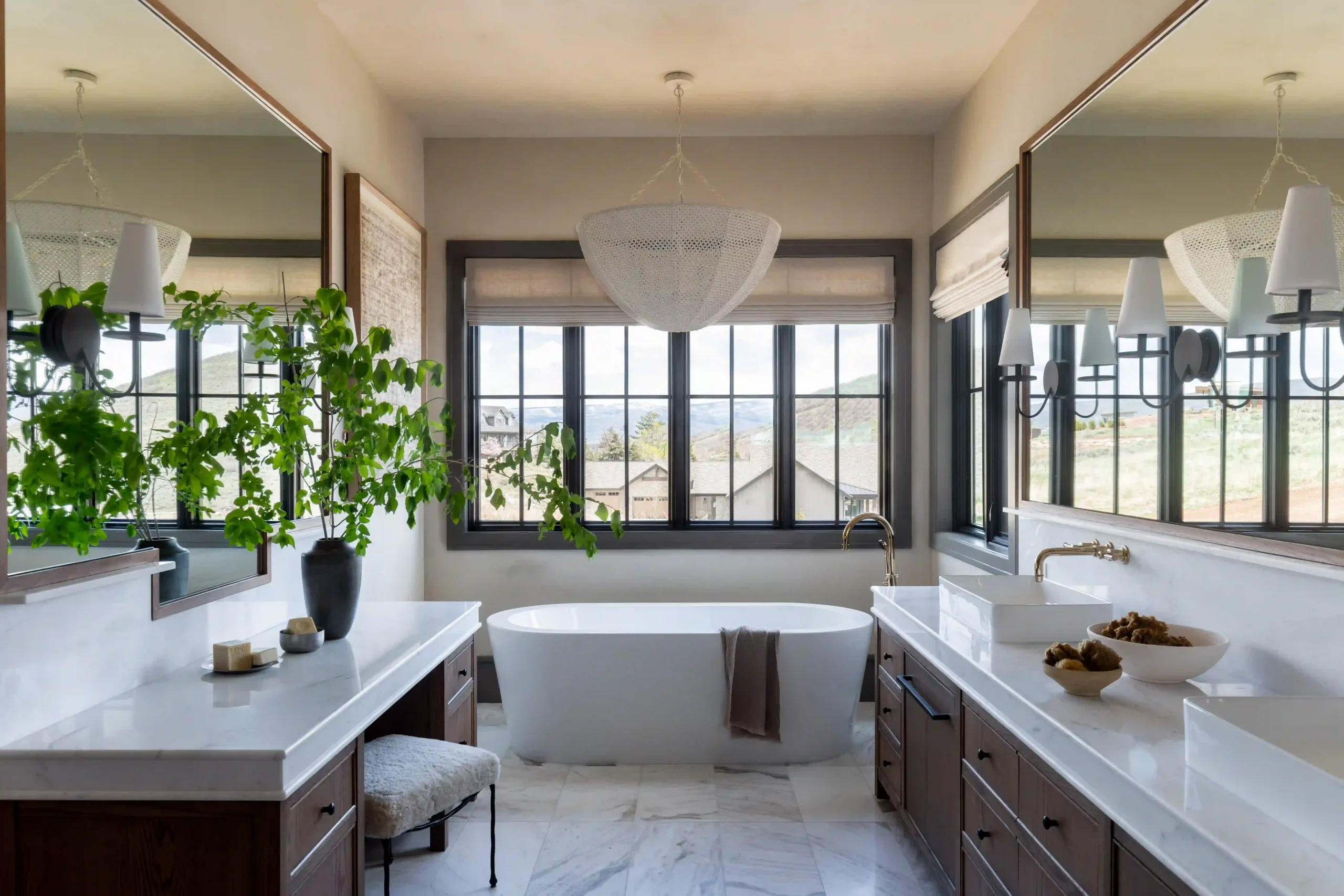 Large living room windows framed by full-length drapery